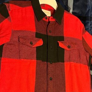 Red and black plaid American Eagle long sleeve button down shirt.